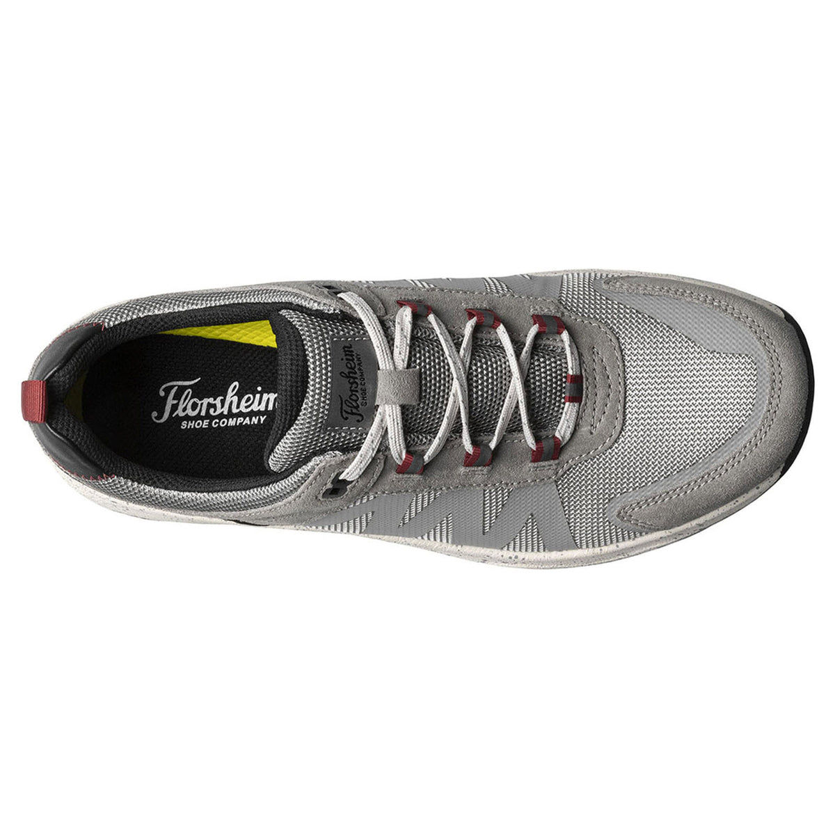 Top view of a gray Florsheim Tread Lite Mesh Lace sneaker with red and black accents, displaying laces and a visible brand label inside.