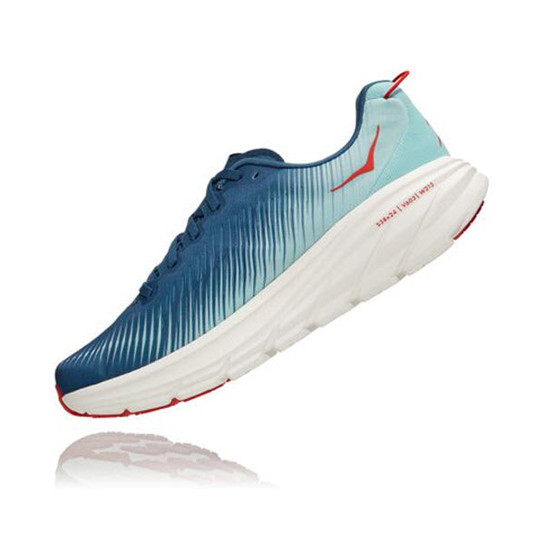 Blue and white Hoka Rincon 3 REAL TEAL/EGGSHELL BLUE running shoe with red accents on a white background, featuring lightweight cushioning.