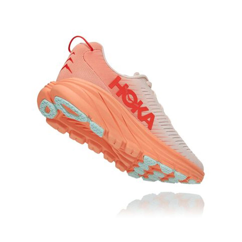 Coral and teal Hoka Rincon 3 running shoe floating against a white background, featuring light midsole foam.