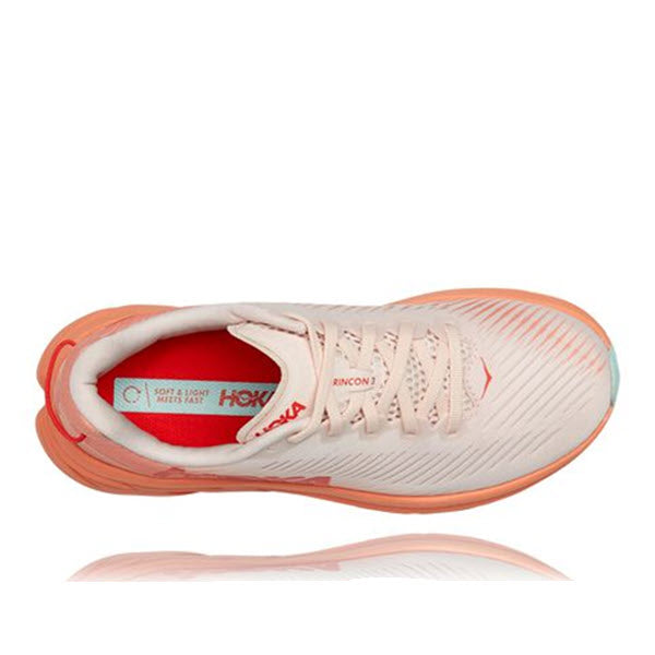 A top view of a single silver peony/cantaloupe HOKA ONE ONE Rincon 3 running shoe with white laces and a visible brand logo.