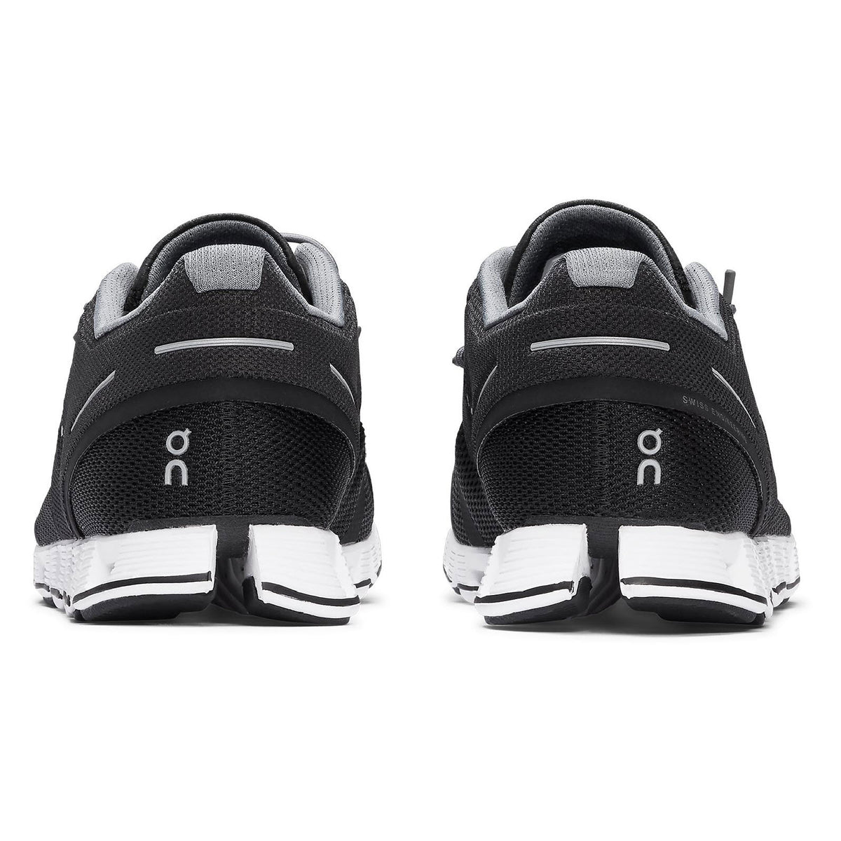 Rear view of a pair of black and white On Running Cloud running shoes with a breathable mesh upper.