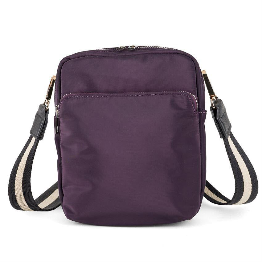 A purple COCO & CARMEN BENUCCHI CROSSBODY EGGPLANT nylon bag with a striped strap.