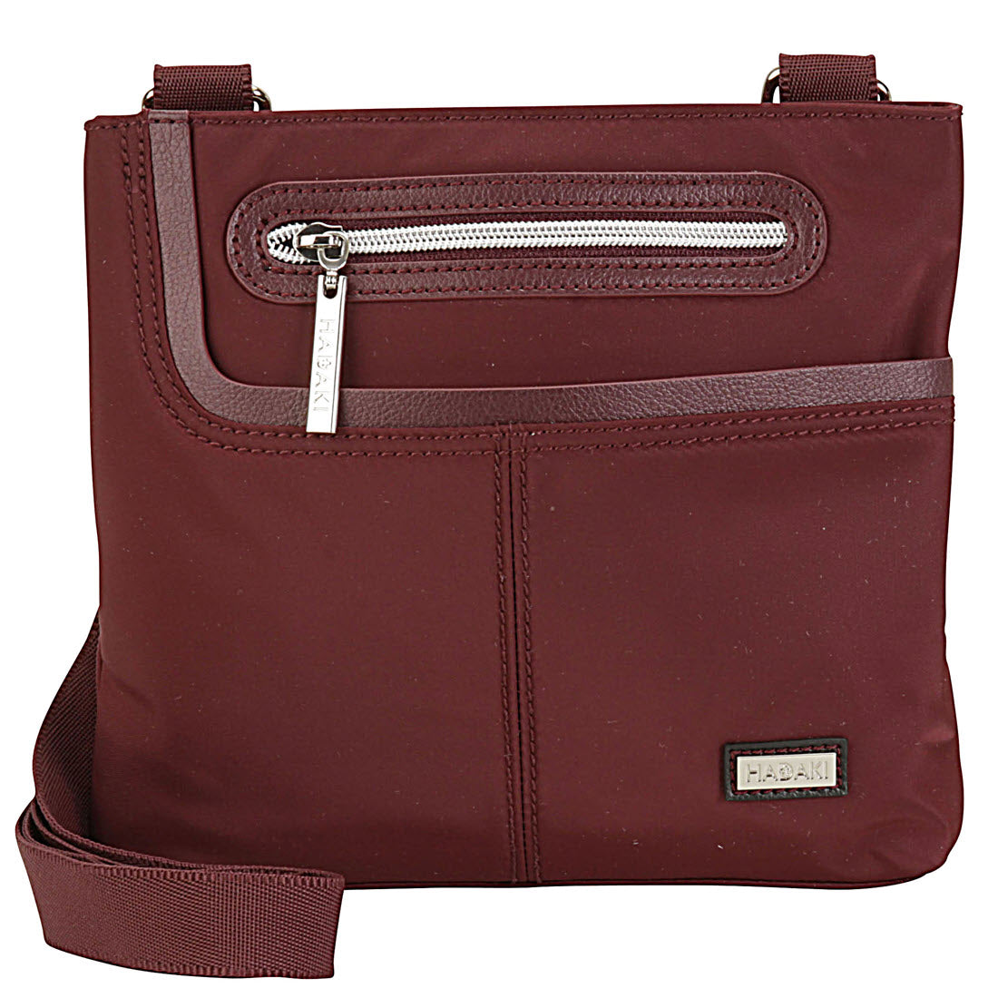 Burgundy Hadaki Mini Me Crossbody bag with front zipper pocket. 
should be substituted with 
MINI ME CROSSBODY WINE by Hadaki