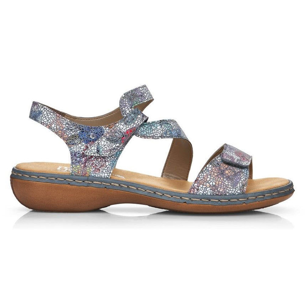 A colorful, mosaic-patterned Rieker COMFORT Z STRAP SANDAL BLUE FLORAL - WOMENS with adjustable Velcro straps, showcased on a white background.