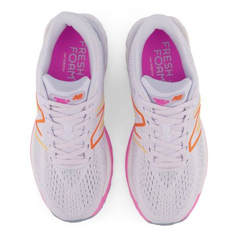 A pair of New Balance 880V12 Libra/Pink/Orange running shoes with gray uppers and vibrant orange and pink accents, viewed from above.