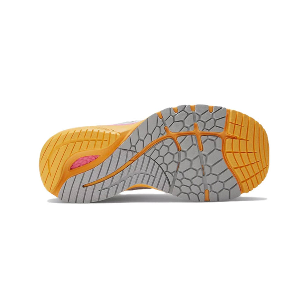 Bottom view of a New Balance stability running shoe showing an orange and gray tread pattern.