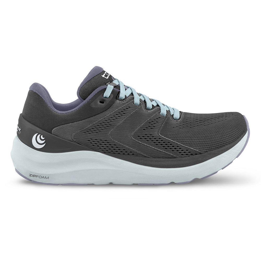 A side view of the TOPO PHANTOM 2 GREY/LILAC women&#39;s athletic shoe displaying its design and Topo brand logo.