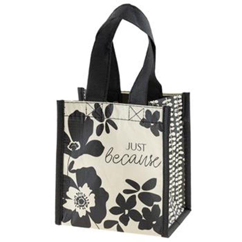 A black and beige reusable tote bag with floral patterns and the text &quot;just because&quot; printed on it, like the Karma Small Gift Bag Ink Floral.