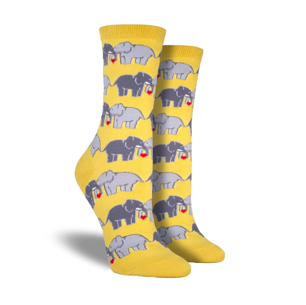 A pair of Socksmith Elephant Love crew socks, patterned with gray elephant couples on a white background, perfect for your next safari outfit.