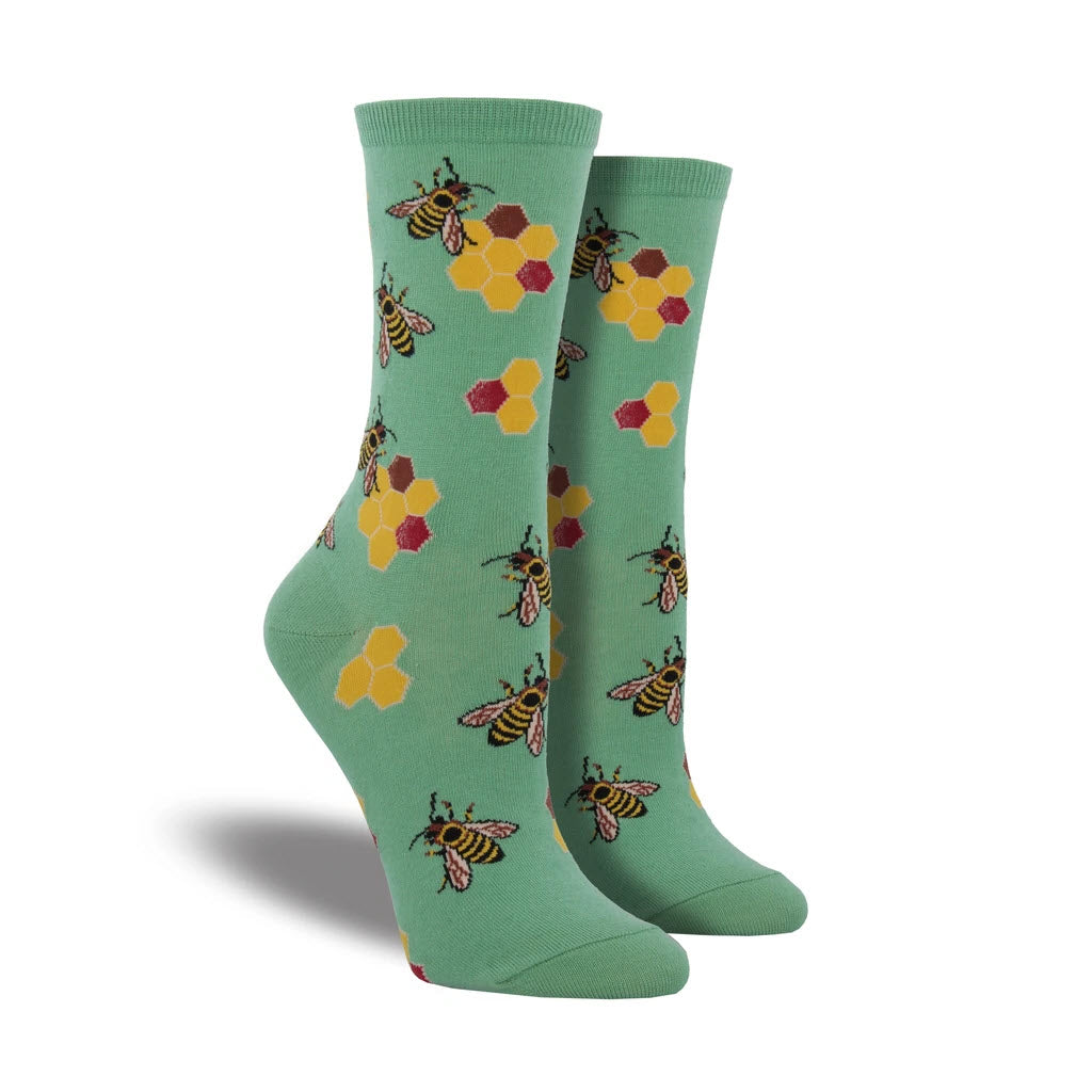 A pair of Socksmith Busy Bees Crew Socks Seafoam - Womens with busy bees and flower pattern on a white background, designed to complement your wardrobe.