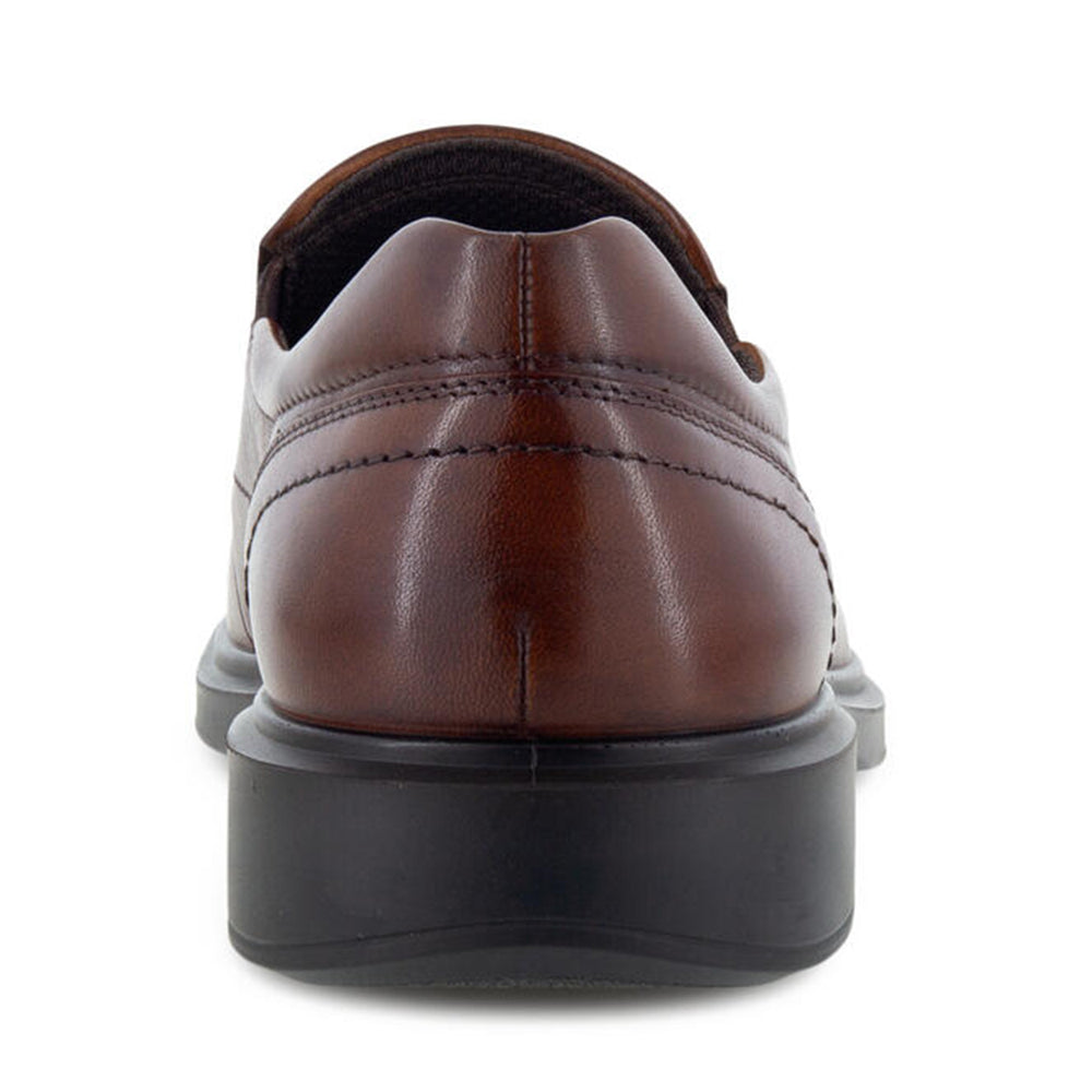 Rear view of a men&#39;s casual Ecco Helsinki 2.0 apron slip on cognac dress shoe with a black sole.