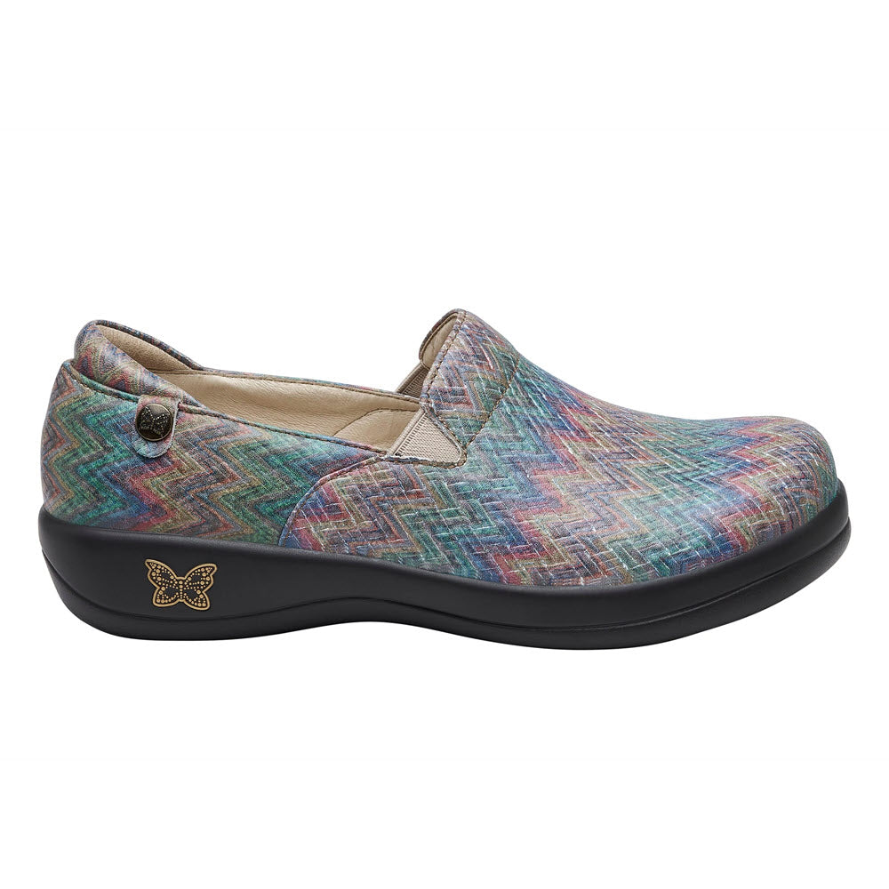 A single Alegria Keli Woven Wonder - Womens slip-on shoe with a strap and a small butterfly emblem, featuring the Woven Wonder print.