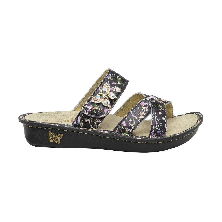 Women&#39;s floral-patterned Alegria Victoriah wedge sandal with butterfly accents on a white background.