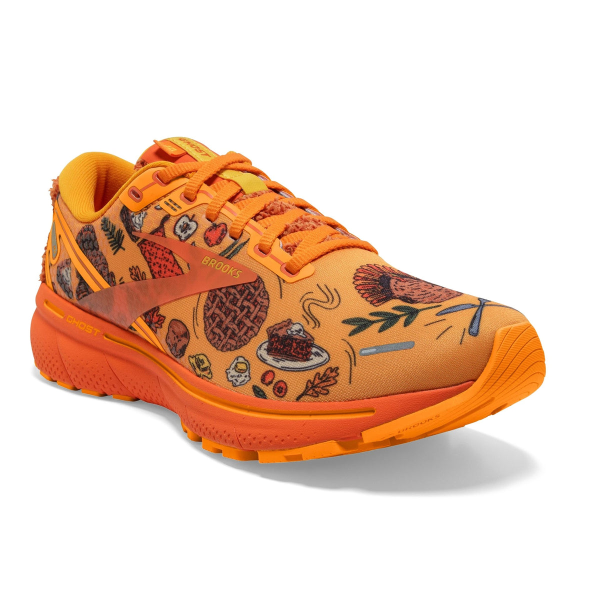 Bright orange Brooks Ghost 14 Citrus/Gold Flame/Orangeade women&#39;s running shoe with patterned designs.