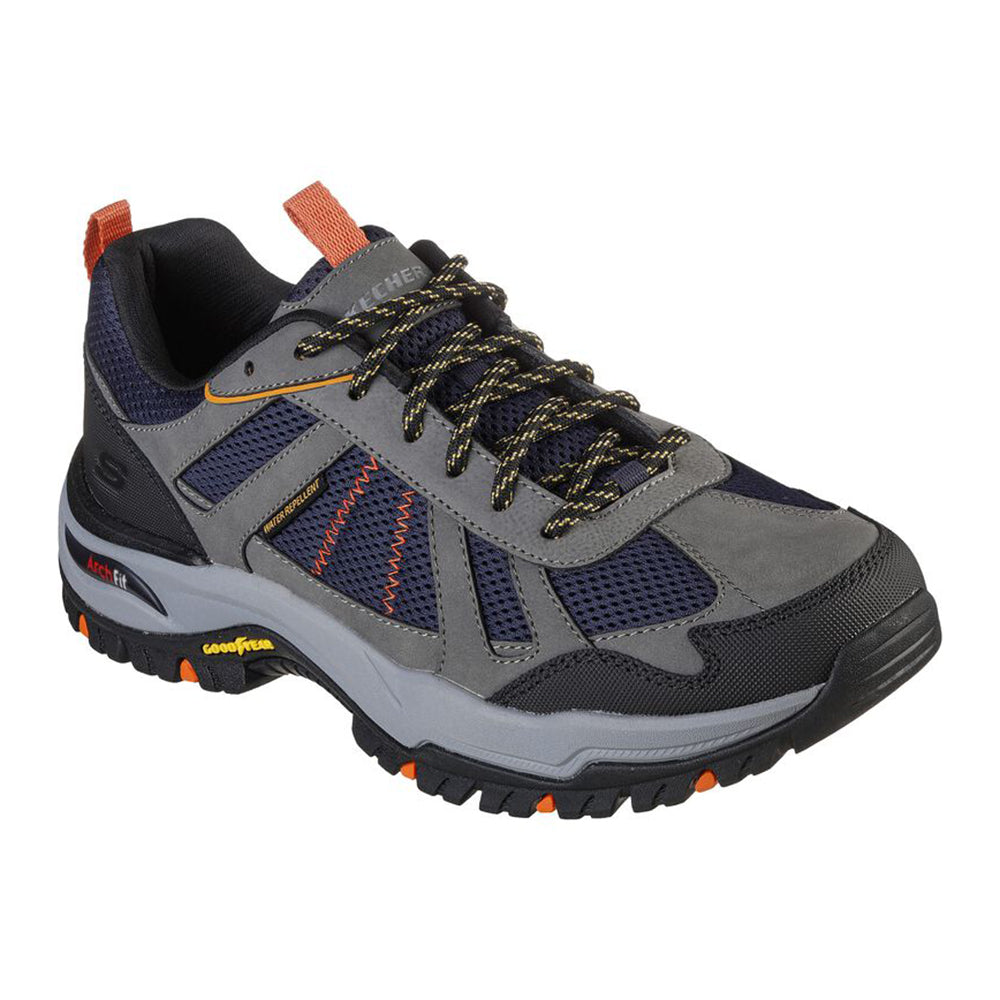 A Skechers Vortego Arch Fit hiking shoe with gray and navy panels, orange accents, and a Goodyear outsole.