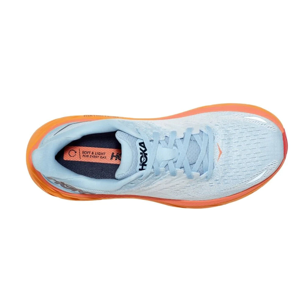 Top view of a single white and orange HOKA CLIFTON 8 SUMMER SONG/ICE FLOW - WOMENS running shoe with an engineered mesh.