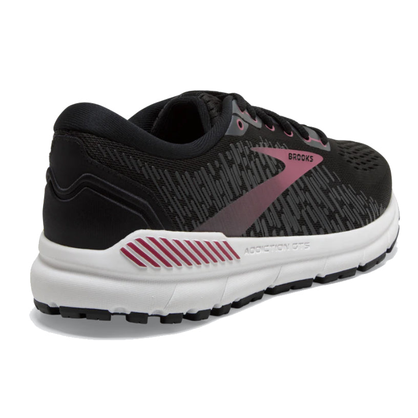 Black and gray Brooks Addiction GTS 15 women&#39;s running shoe with pink accents.