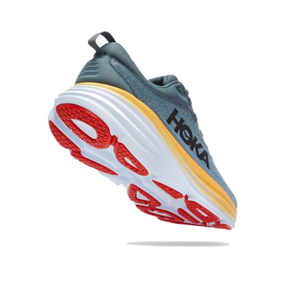 Side view of a Hoka Bondi 8 Goblin Blue/Mountain Spring running shoe with a thick white sole and red tread patterns, designed for neutral running.