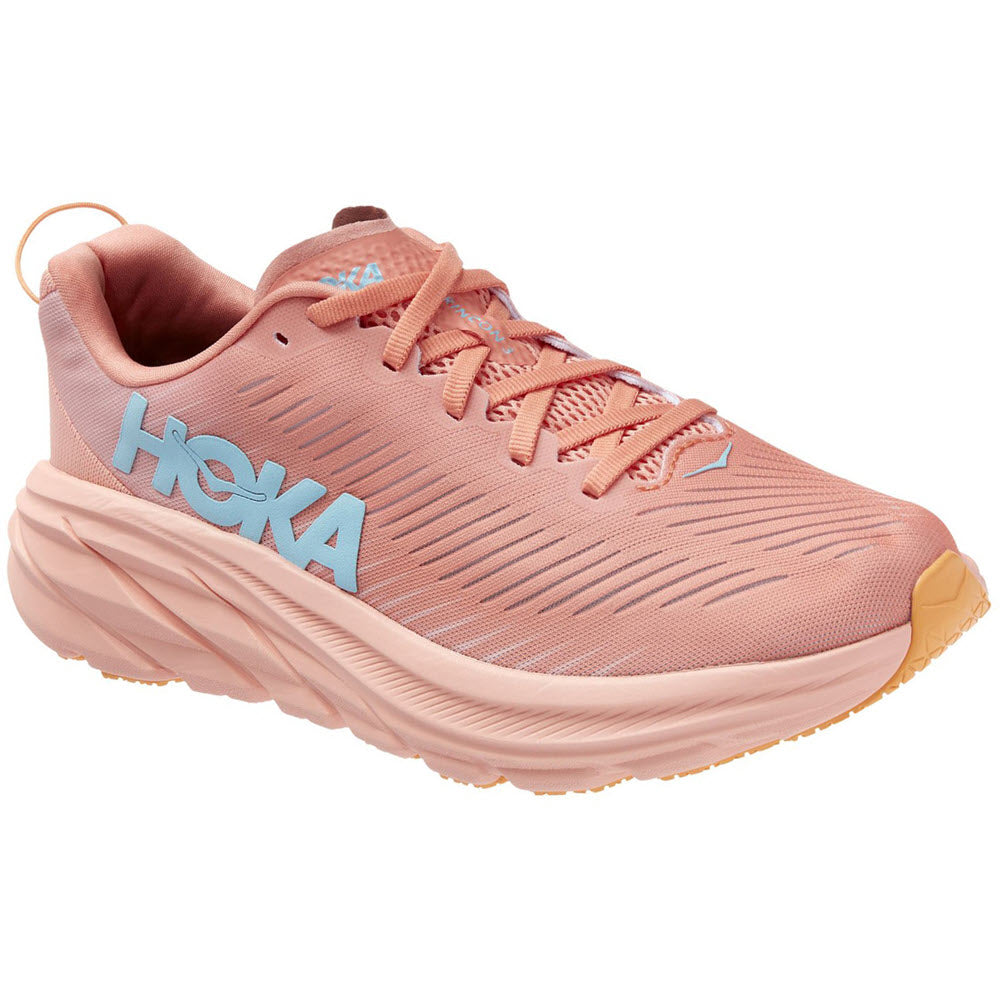A single pink Hoka One One Rincon 3 Shell Coral/Peach Parfait running shoe with a vented-mesh upper and prominent branding on the side.