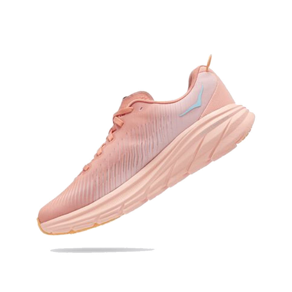 Pink Hoka lightweight running shoe with white sole and blue logo detail on white background.