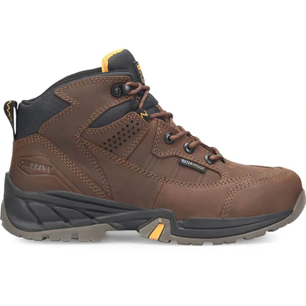 A single CAROLINA STEEL TOE BUILDER BROWN CA4501 - MENS hiking boot with black and yellow accents and a steel toe on a white background.