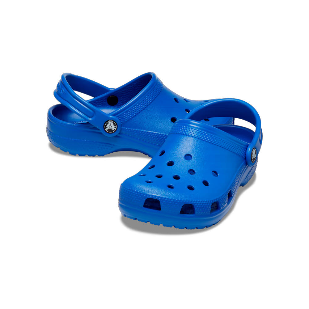 A pair of bright blue Crocs Classic Clog Kids Blue Bolt against a white background.