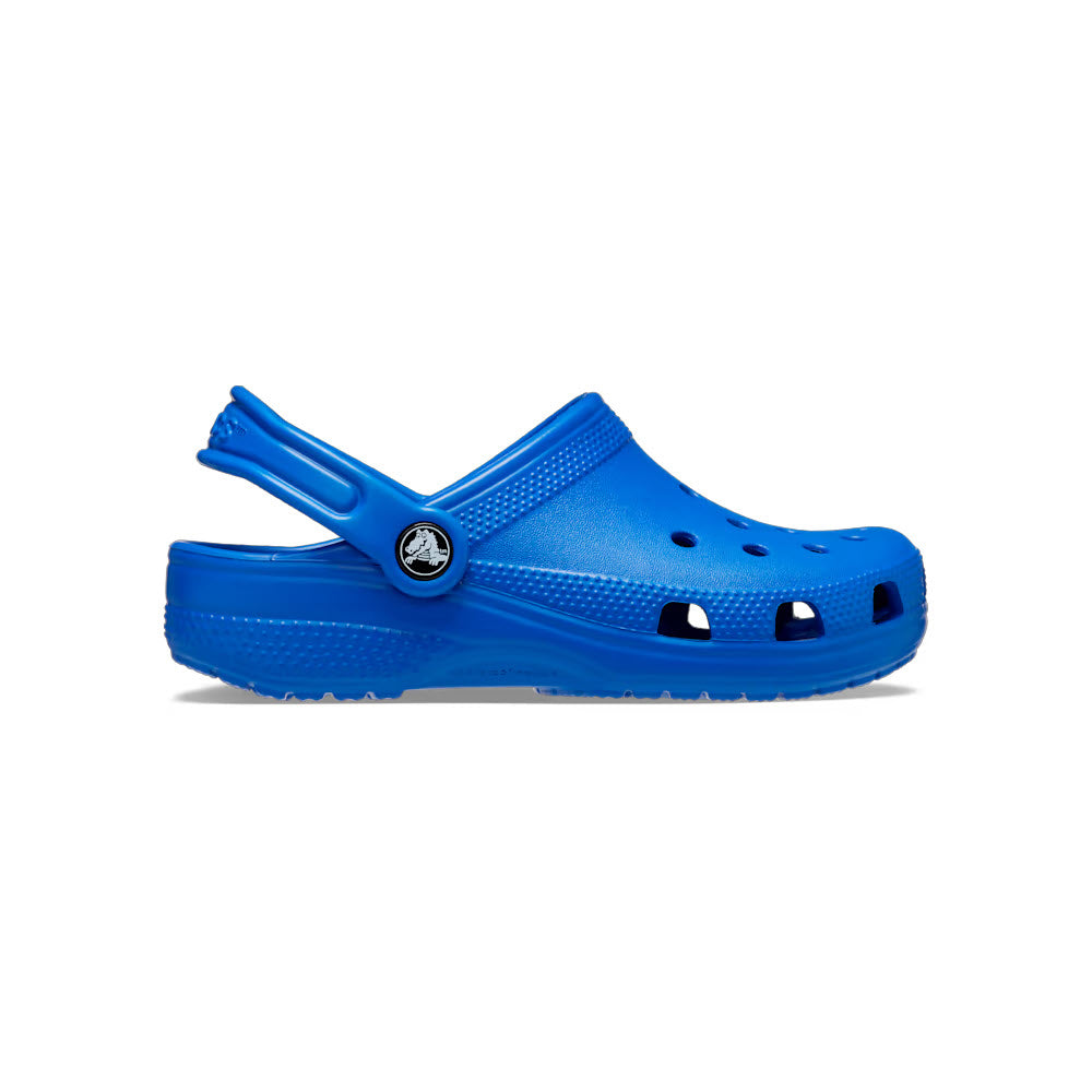 A single bright blue Crocs Classic Clog Kids Blue Bolt displayed against a white background, featuring the iconic perforated design and pivoting heel strap.
