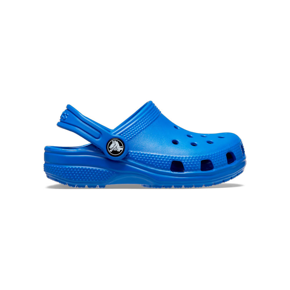 A single bright blue kids' Crocs shoe displayed against a white background, featuring multiple ventilation holes and a pivoting heel strap.