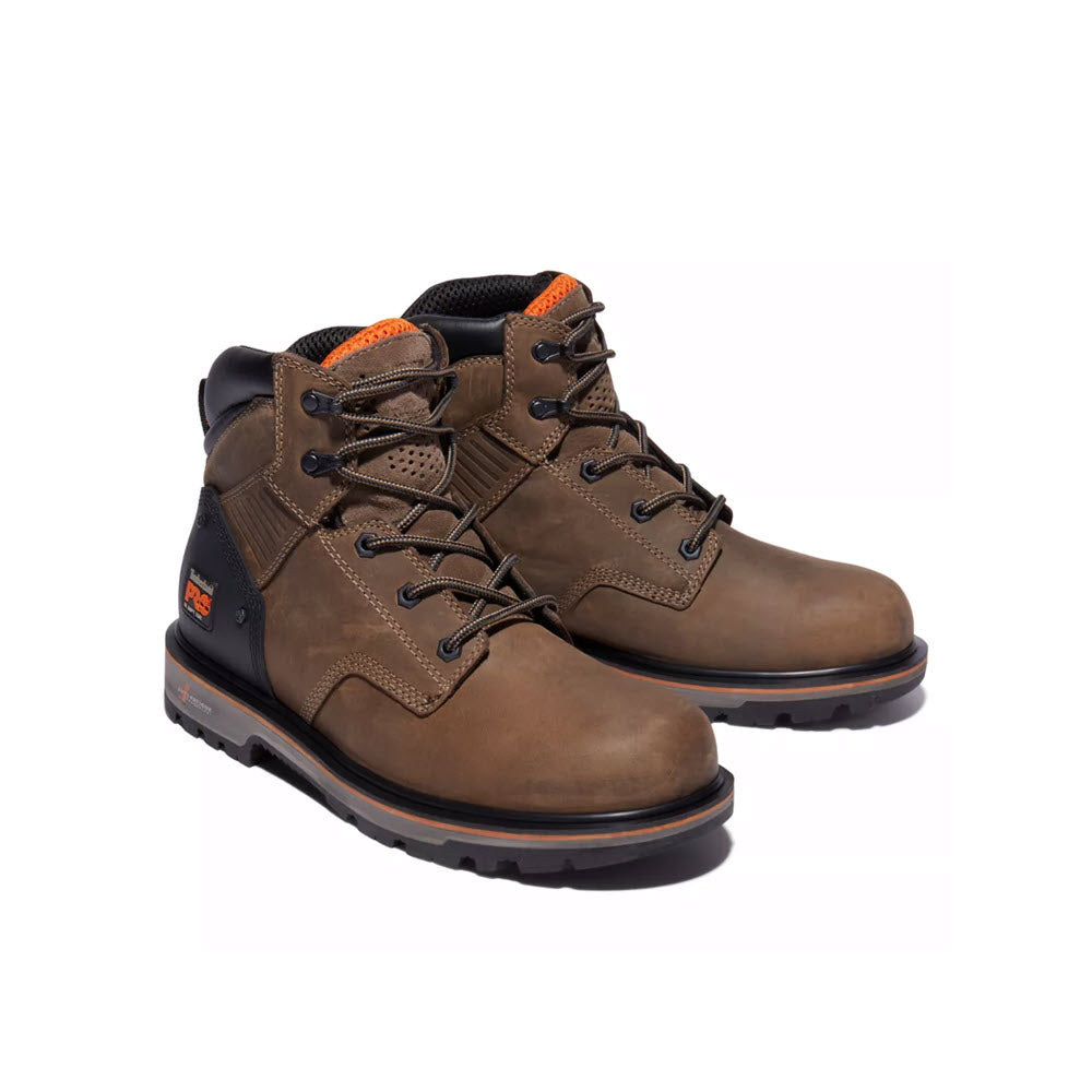 A pair of Timberland Pro Ballast 6 Inch work boots with orange accents on a white background, featuring anti-fatigue technology.