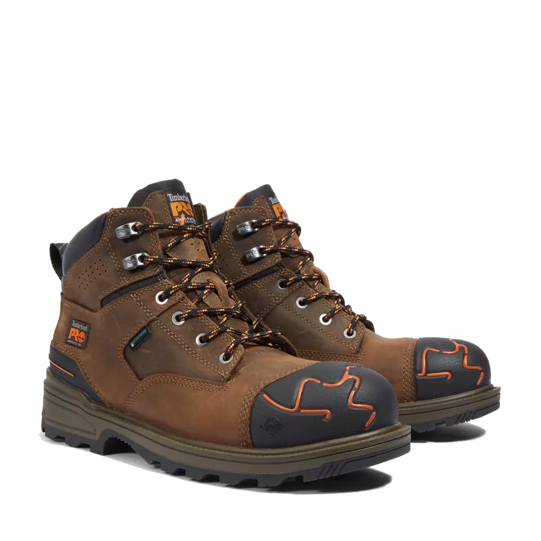 A pair of Timberland CT Magnitude 6&quot; WP Mocha Mens waterproof brown leather industrial boots with lace-up fronts, a logo on the side, and composite safety toe boot design.