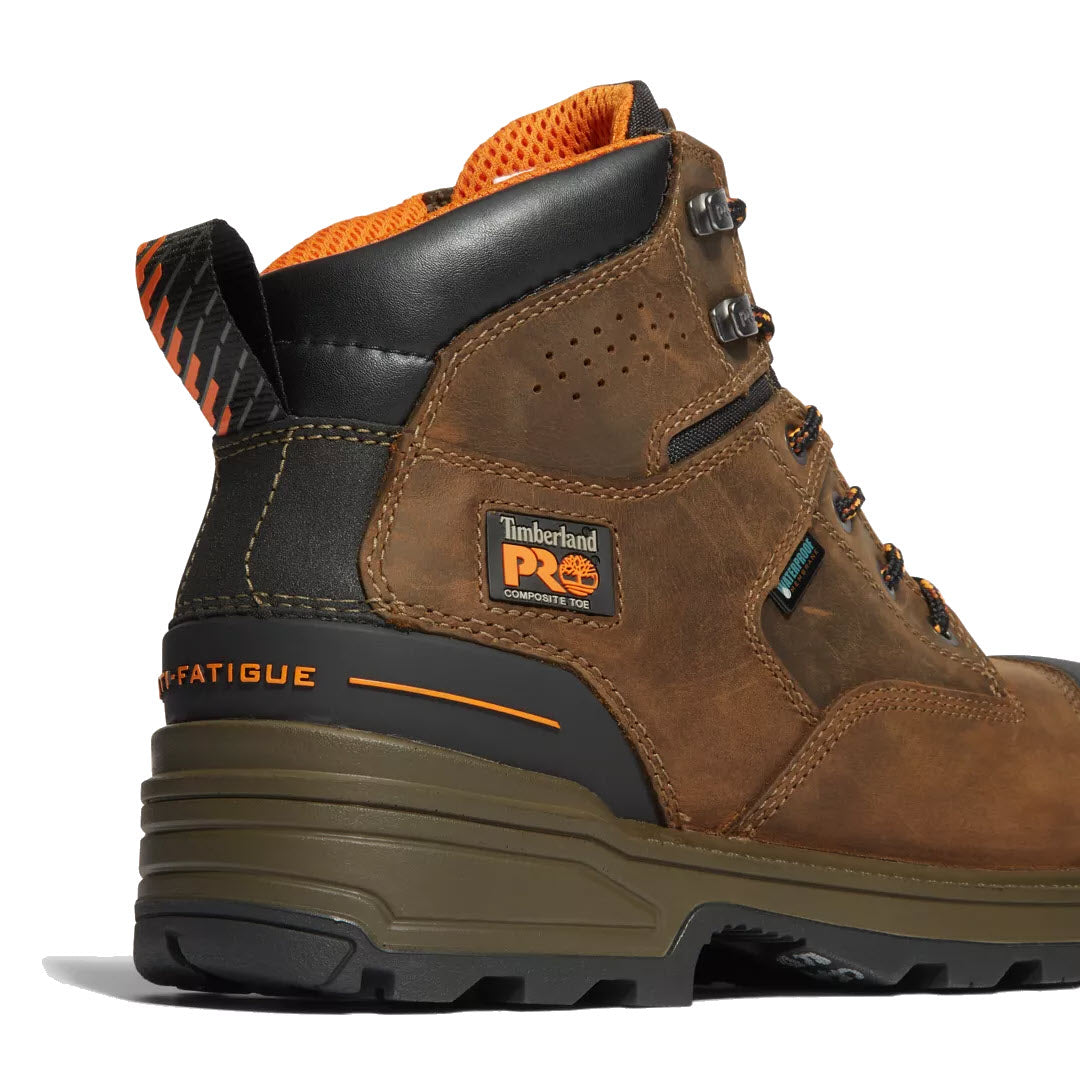 A close-up of a Timberland TIMBERLAND CT MAGNITUDE 6&quot; WP MOCHA work boot featuring an anti-fatigue heel, an orange padded collar, and composite safety toe.