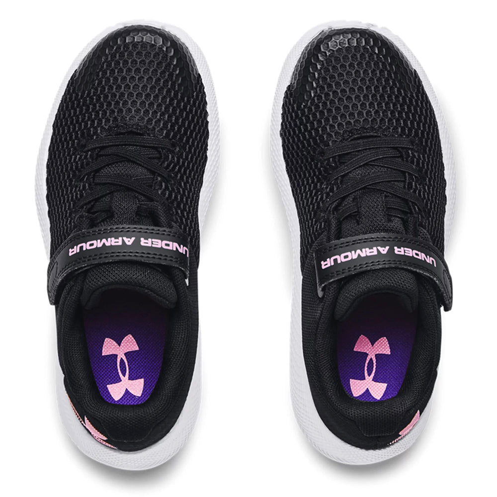 A pair of Under Armour Pursuit 2 AC Black - Kids athletic shoes with white soles and a visible purple logo on the insoles, viewed from above.