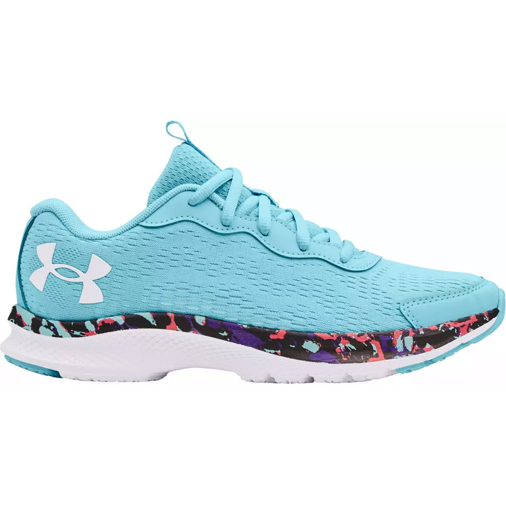 A light blue Under Armour Charged Bandit 7 kid’s athletic shoe with a patterned sole.