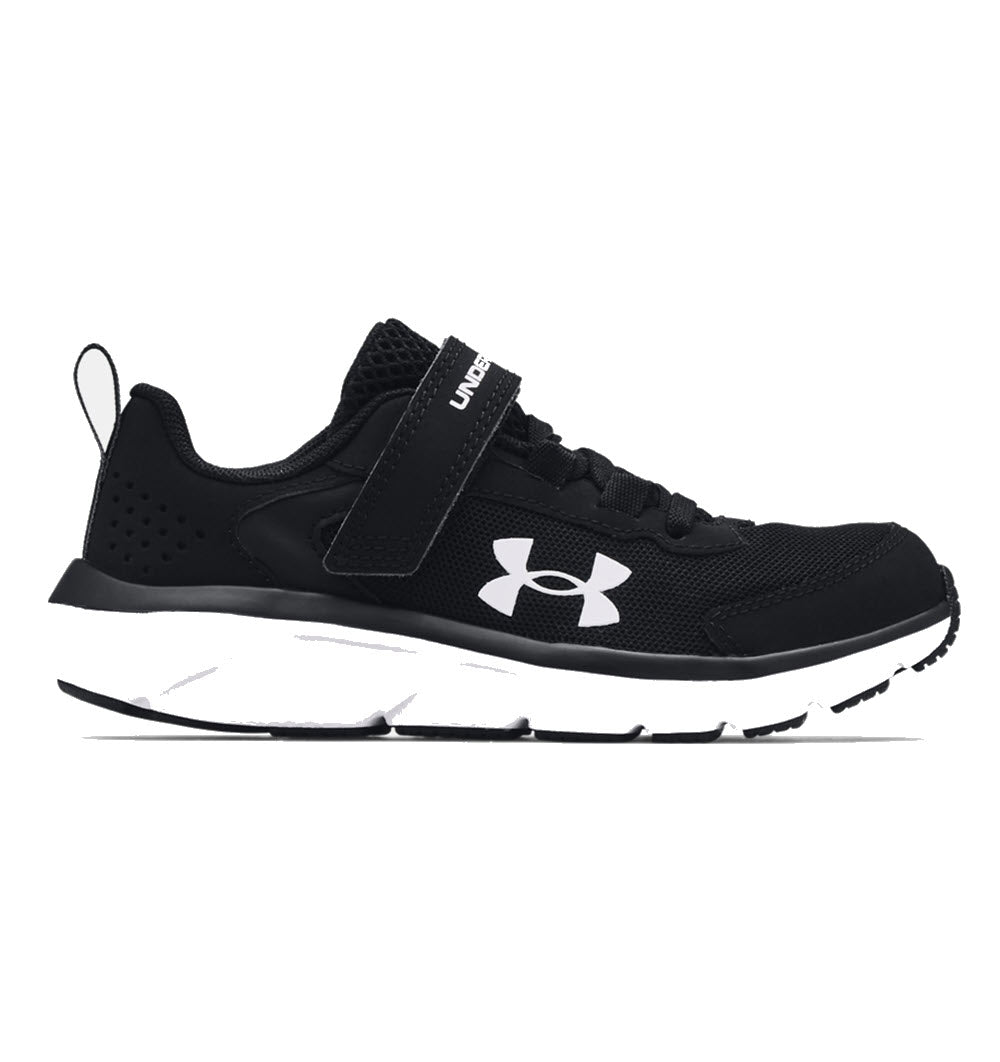 UNDER ARMOUR ASSERT 9 BLACK - KIDS athletic shoe with white sole.