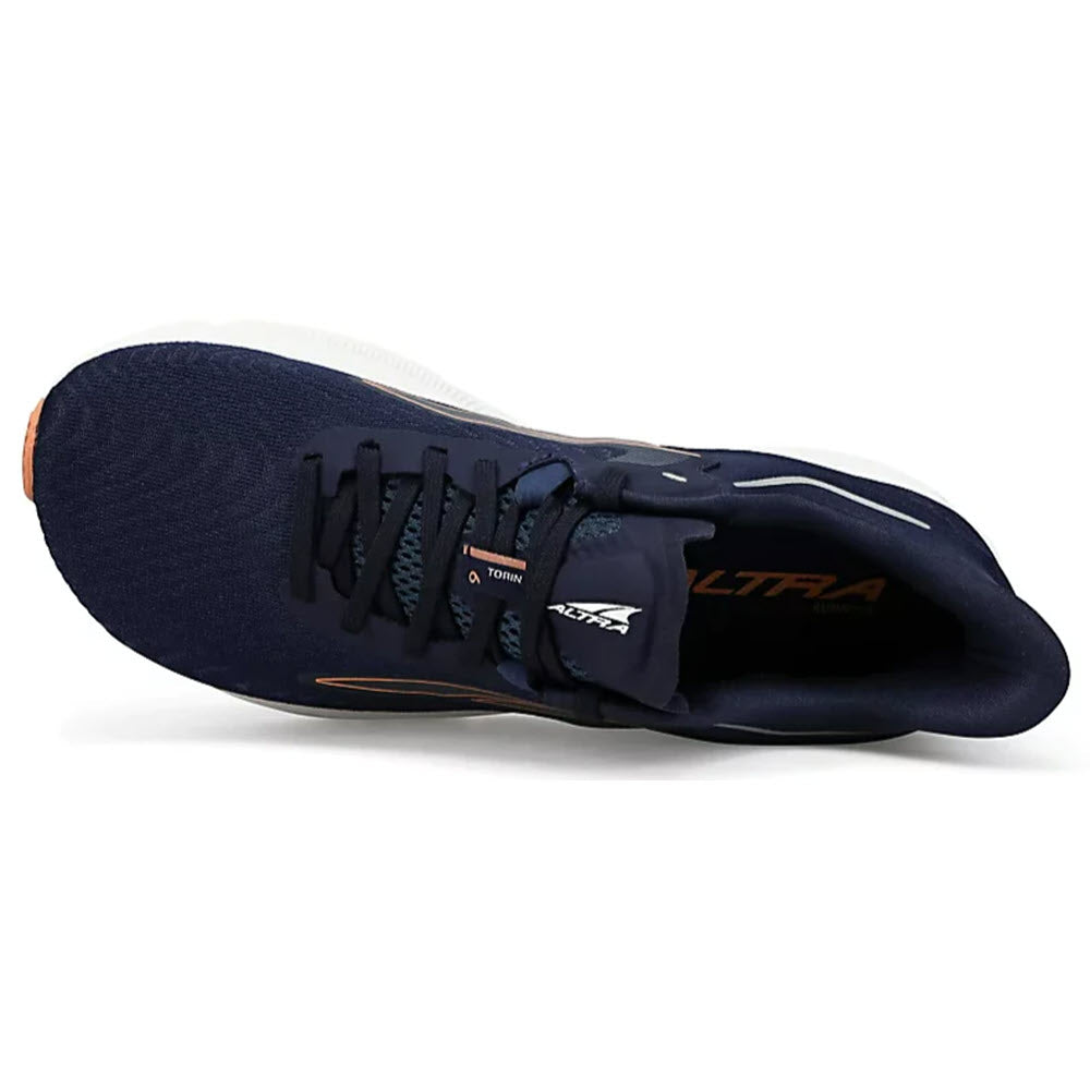 Top view of a navy blue Altra Torin 6 running shoe with a white sole and branding on the insole.