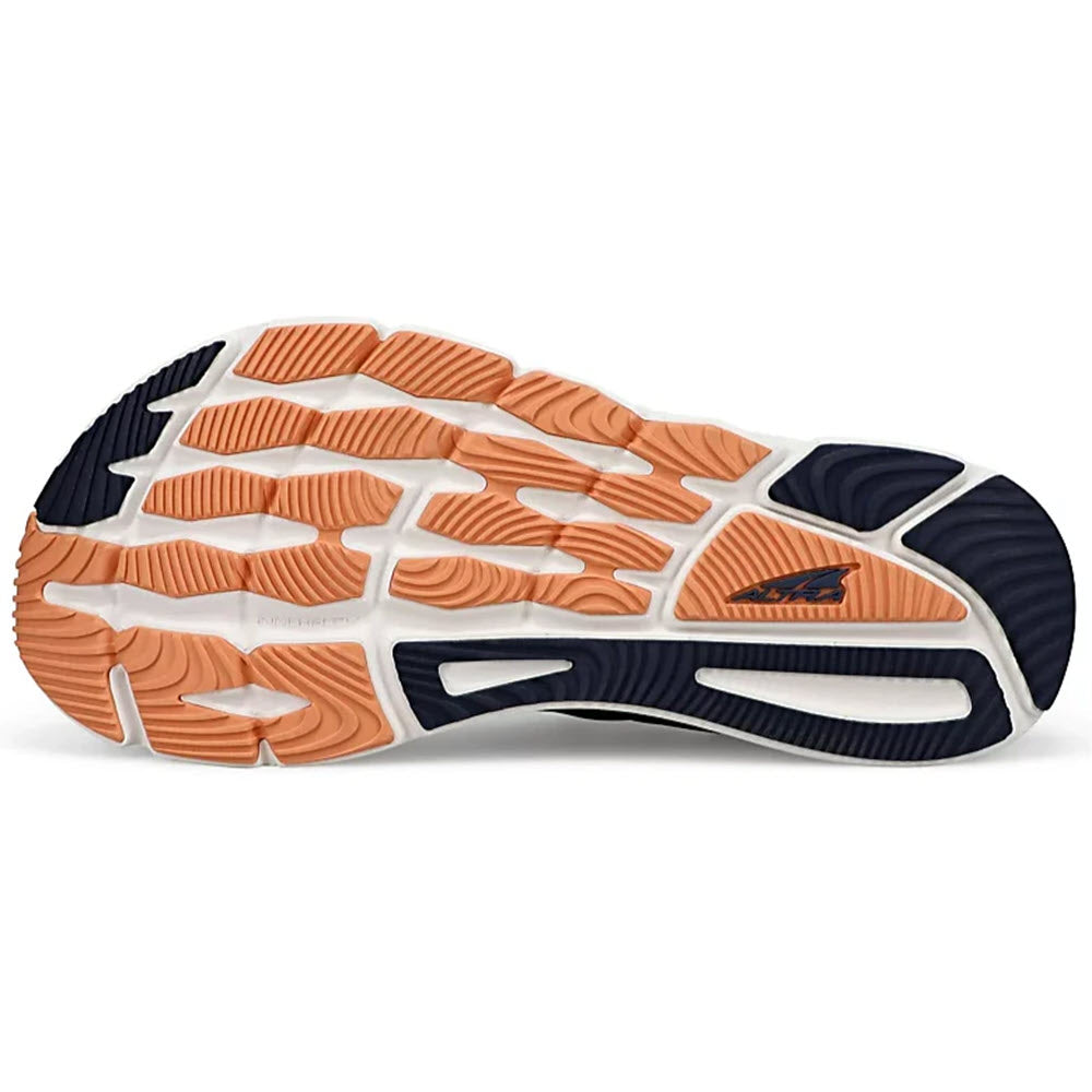 Close-up of a running shoe sole with orange treads and ALTRA TORIN 6 NAVY/CORAL - WOMENS brand logo.