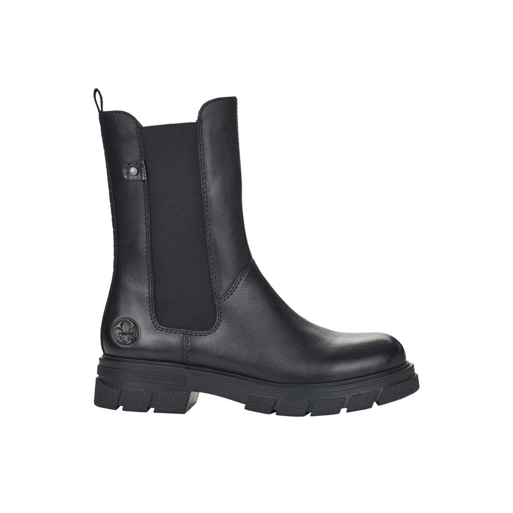 A Rieker black leather chelsea boot with a thick sole and a logo emblem on the ankle, featuring elastic gore panels and a pull tab.