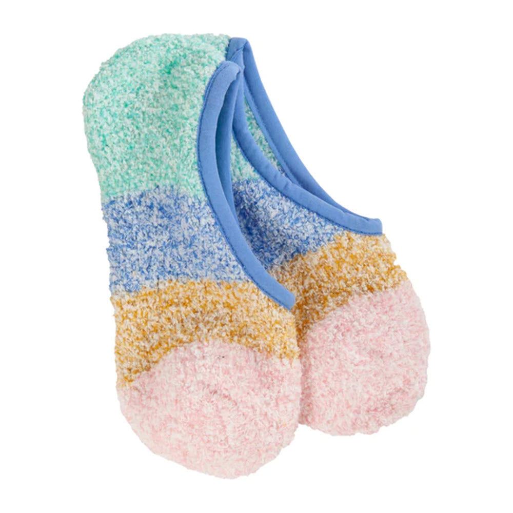 A pair of colorful, fluffy Worlds Softest Cozy Footsie socks in blue multi polyester with non-slip texture on an isolated white background.