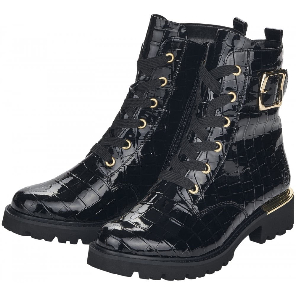 A pair of black patent leather Remonte Lug Sole Combat Bootie in black croc pattern design, with gold buckle detail and gold-colored hardware.