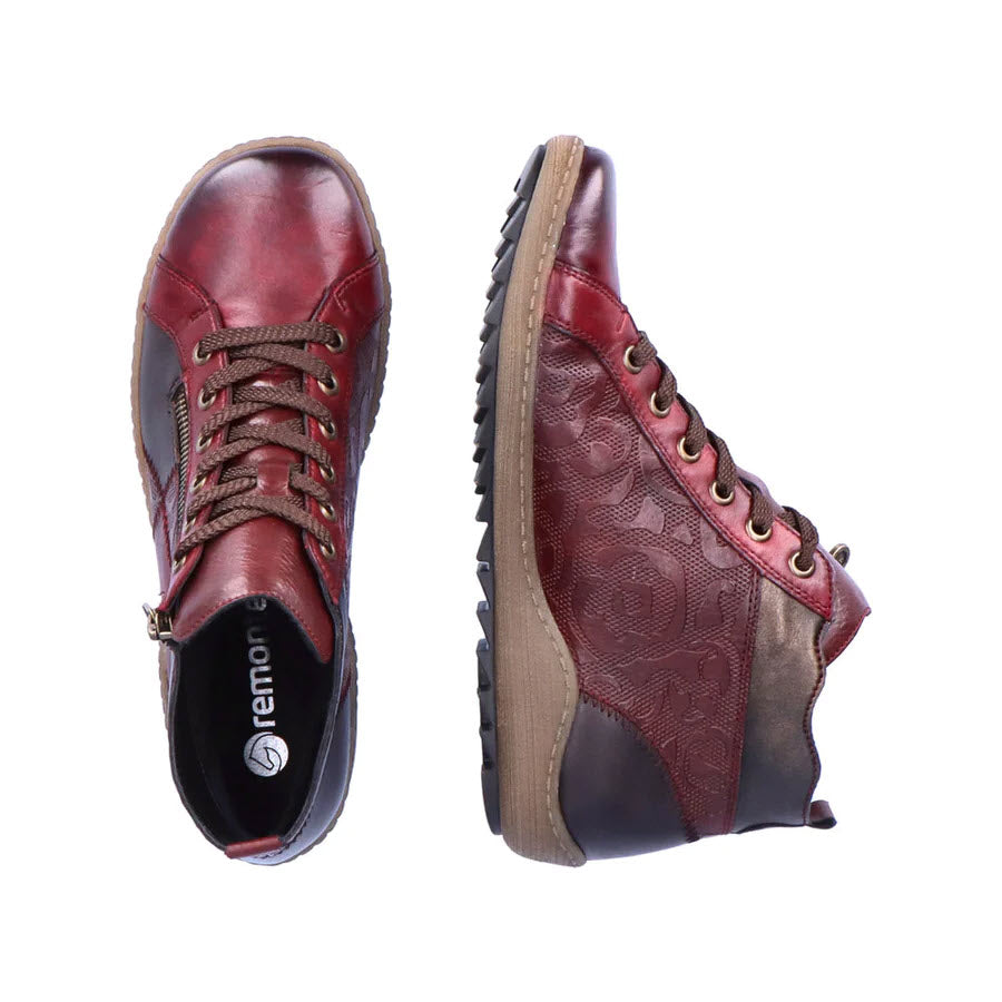 A pair of Remonte Mixed Material High Top Wine Combi womens lace-up boots isolated on a white background.