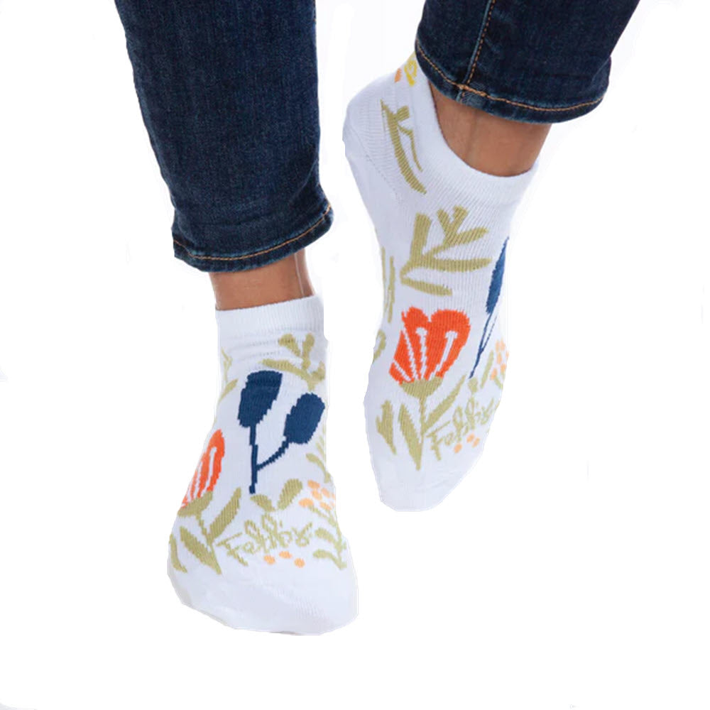 Person wearing Worlds Softest Strong as a Mother low cut socks with floral design, made in USA, standing on tiptoes.