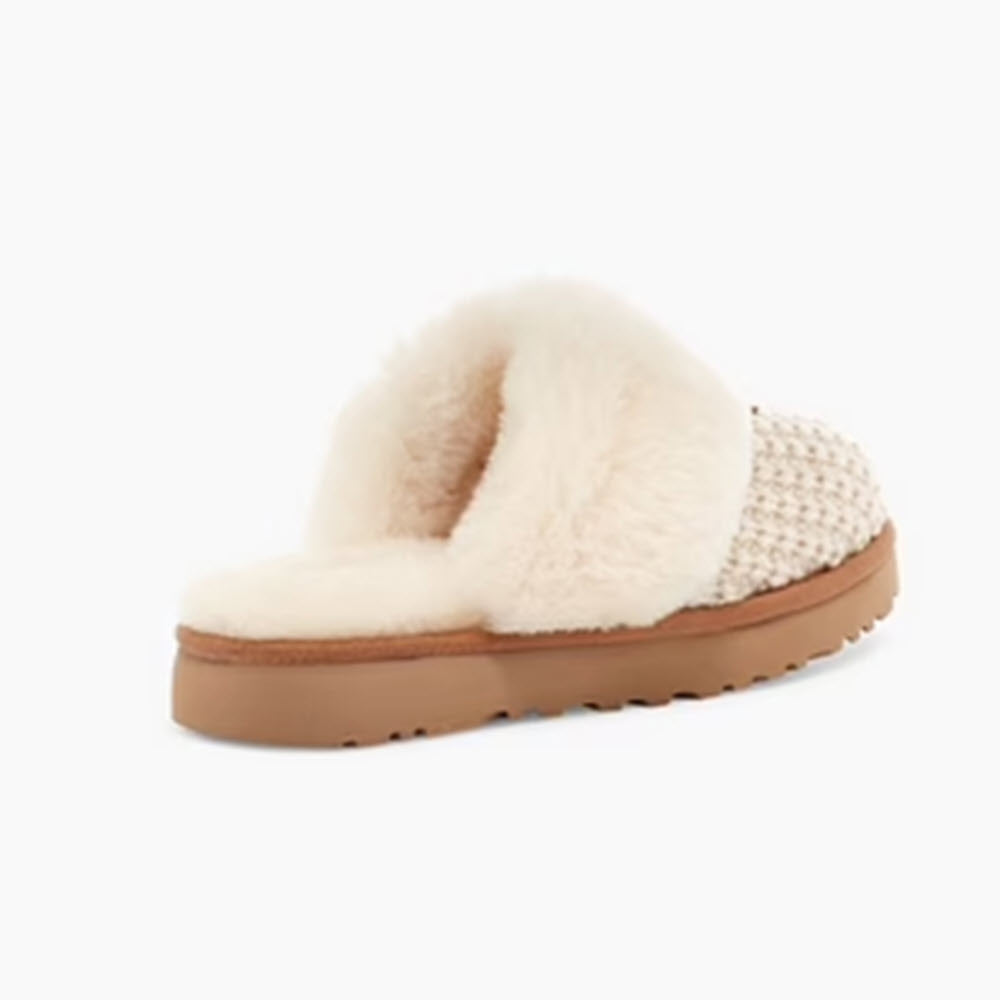 A single UGG Cozy Knit Cream furry slider slipper with a sweater-knit upper and woven detailing on a flat sole.