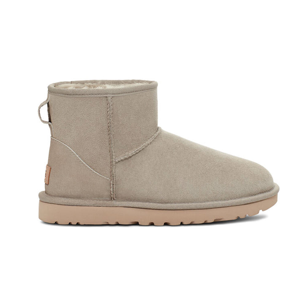 Beige short water-resistant winter UGG Classic Mini II Goat boot on a white background.