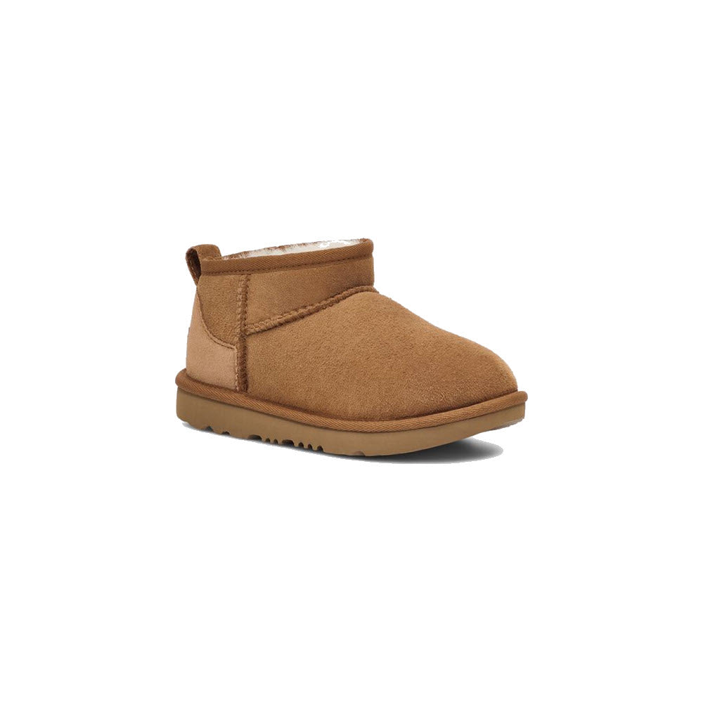 A single UGG Classic Ultra Mini Chestnut ankle boot featuring a sheepskin lining and a strap closure against a white background.
