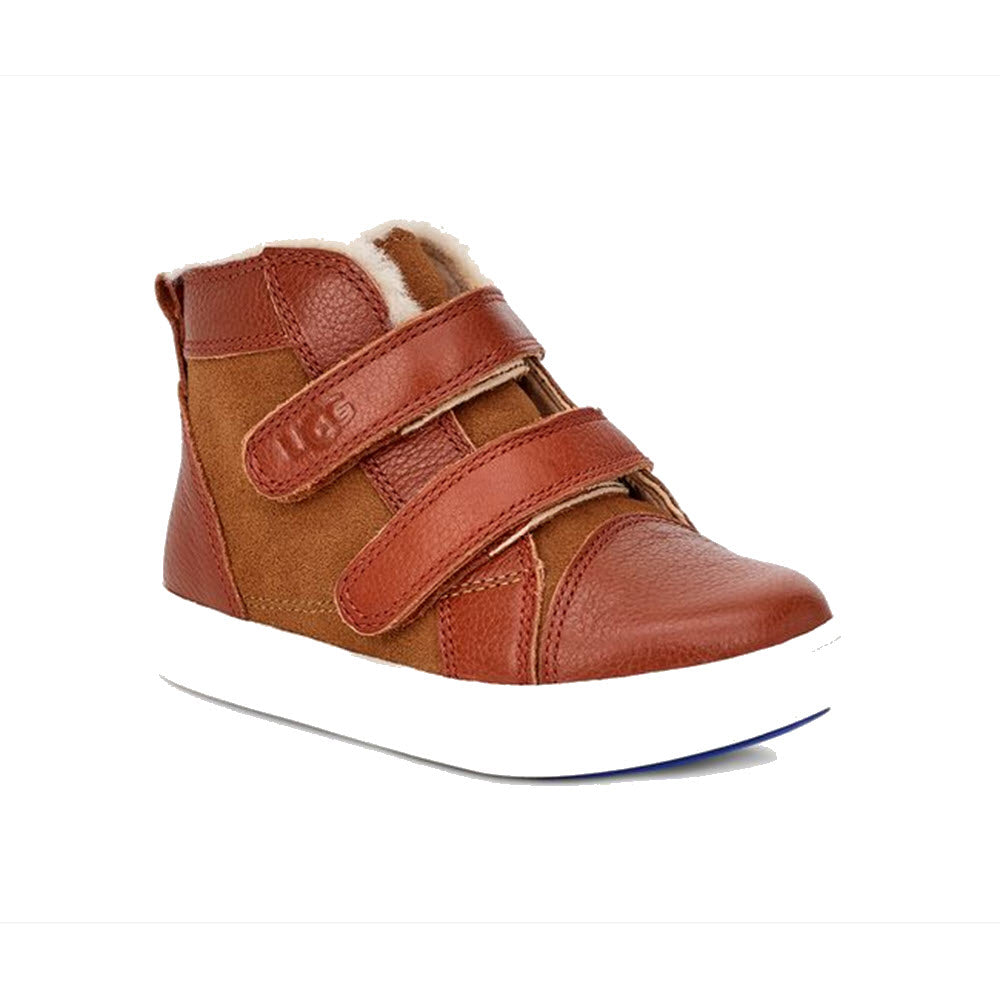 A child&#39;s UGG RENNON II WEATHER CHESTNUT high-top shoe with hook-and-loop closures on a white background.