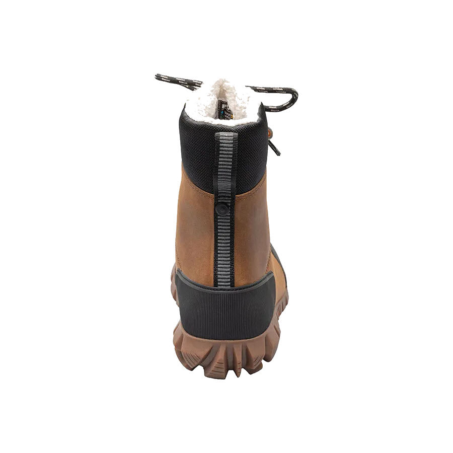Winter boot with zipper front, waterproof leather uppers, and fur lining on white background. 
Product: Bogs Arcata Leather Caramel - Womens