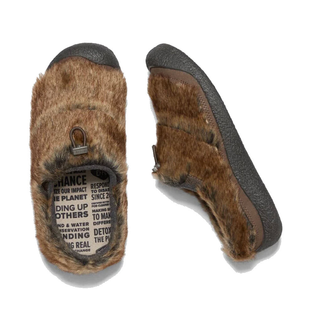 A pair of KEEN HOWSER III SLIDE CANTEEN - WOMENS hybrid slip-on sandals with a label on the upper part.