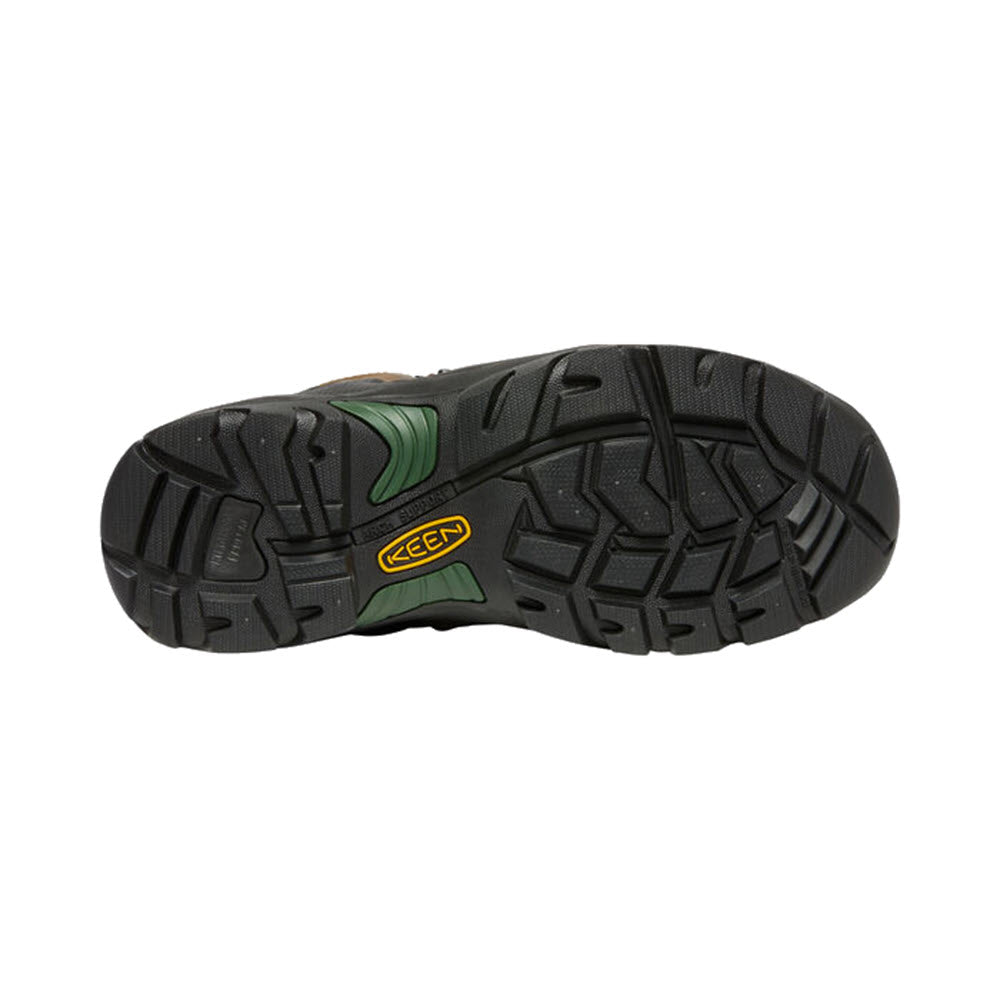 Bottom view of a black hiking shoe sole with green accents, displaying the tread pattern and brand &quot;Keen&quot; logo, featuring a Keen.ReGEN midsole in the KEEN PITTSBURGH COMP TOE 6&quot; WP CASCADE BROWN - MENS.