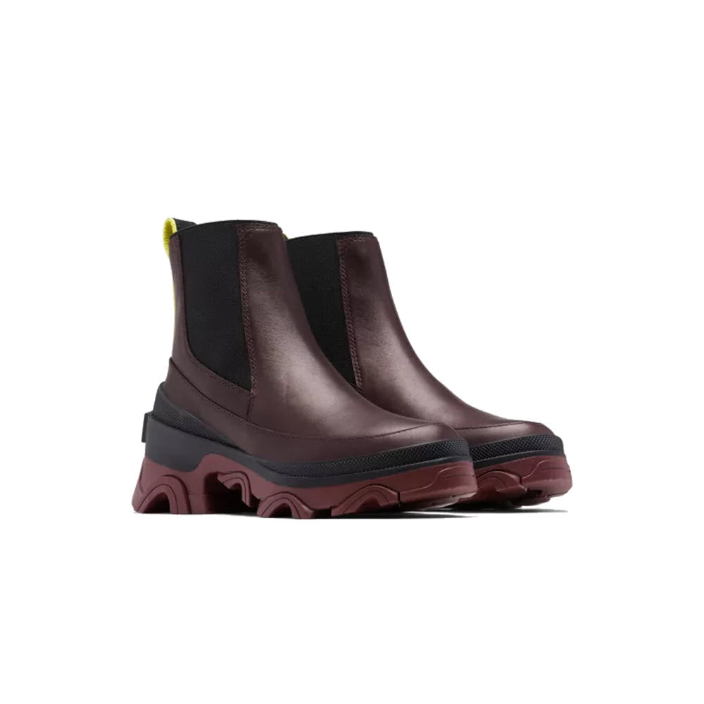 A pair of brown Sorel Chelsea boots with a high-traction rubber sole on a white background.