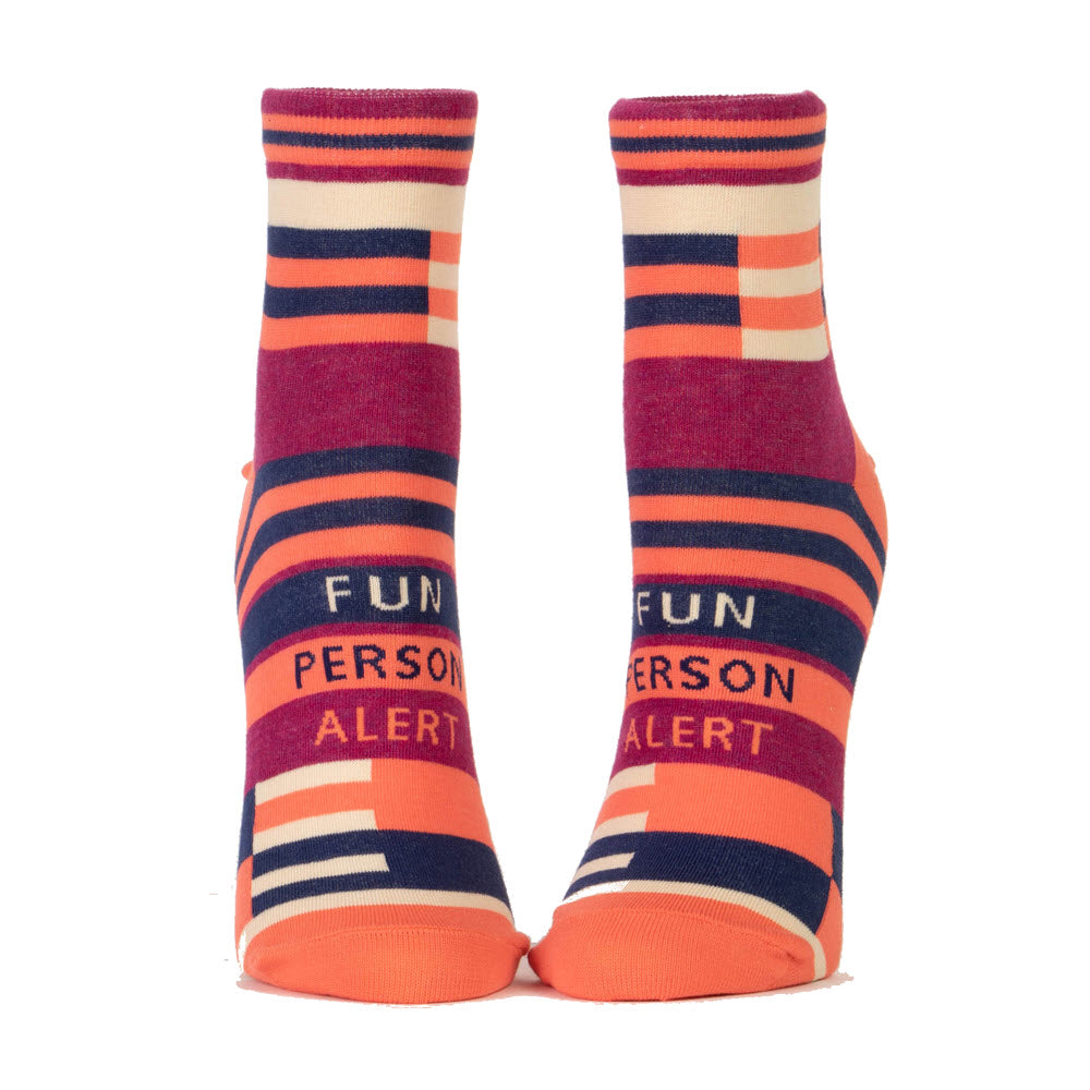 A pair of Blue Q ankle socks with the text &quot;fun person alert&quot; on the soles, fitting women&#39;s shoe size 5-10.